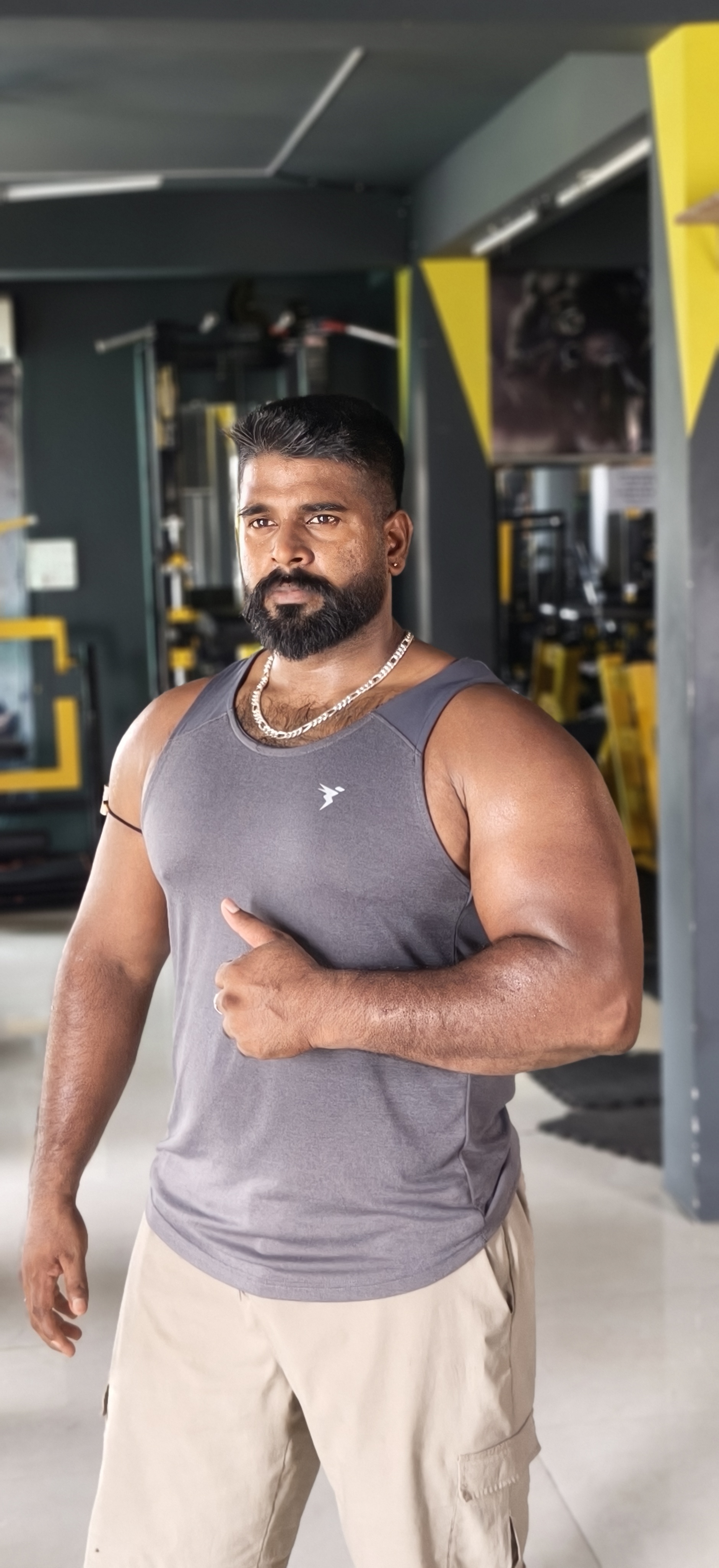 Personal trainer coaching a member through strength training